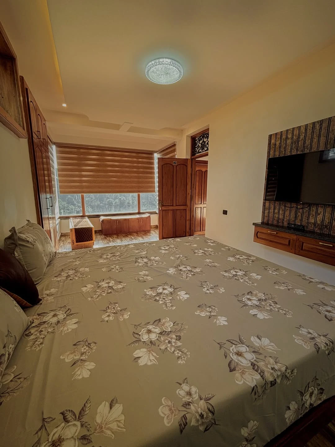 Orchid Suite with white linen and wooden panelling